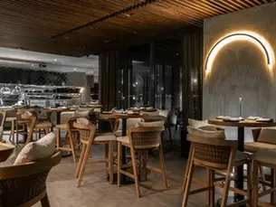 Indoor dining at Rosa Negra Miami on a rainy day in Brickell